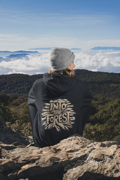 Featuring the phrase "Into the Forest" uniquely crafted in tree branch lettering, this design brings the beauty and mystery of the woods to life.